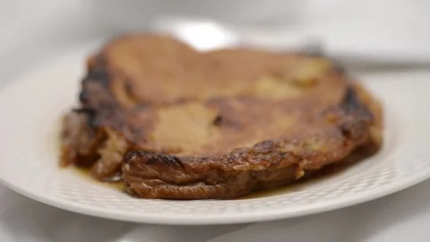 Slow-motion closeup pan of toronjas - sweet wine-soaked Easter Week bread w.. Vídeo Stock 306728261