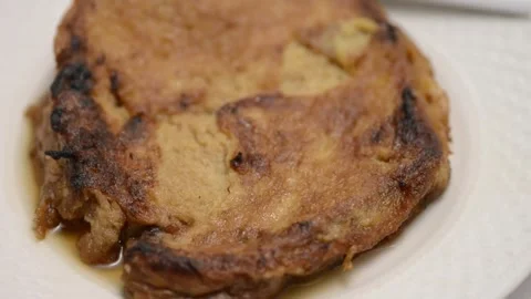 Slow-motion closeup pan of toronjas - sweet wine-soaked Easter Week bread w.. Vídeo Stock 306728264