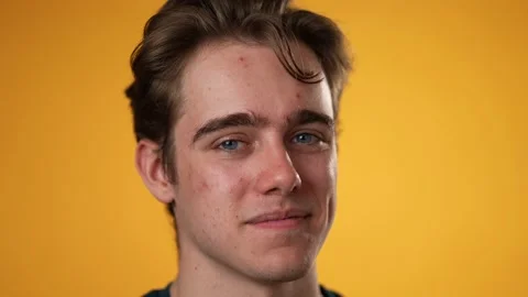 Slow motion closeup portrait of smiling happy young hipster man 20s isolated on Stock Footage 220776016