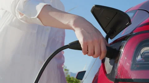 Slow motion closeup RED camera shot under hatch where electric eco car charges 스톡 동영상 171602777