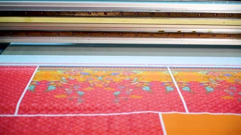 Slow motion closeup shot of automatic color printing machine in textile fact Stock Footage 199271487