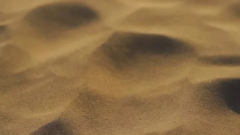 Slow motion closeup shot of sand dust of sand dunes flowing in the air Stock Footage 172529056