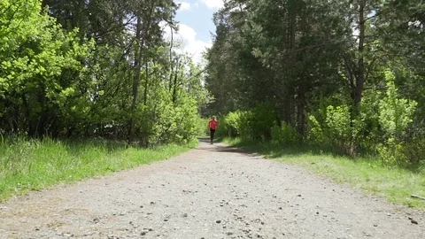 Slow motion closeup shot of young active woman with ponytail exercising at Видео 75975858