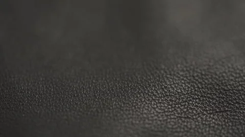 Slow motion closeup slide shot of soft gray brown leather Stock Footage 241094420