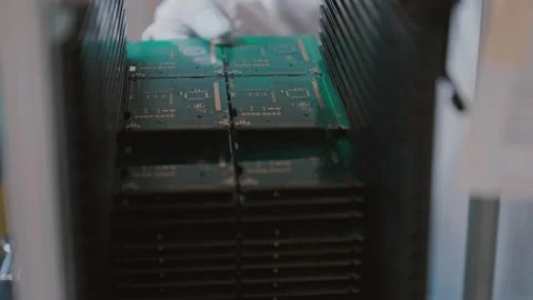 Slow Motion Closeup of Stacked Circuit Boards in Factory Setting Video stock 316574459
