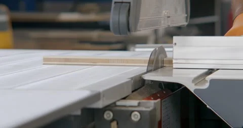 Slow motion Closeup of table saw cutting a slab of wood Stock Footage 336062557