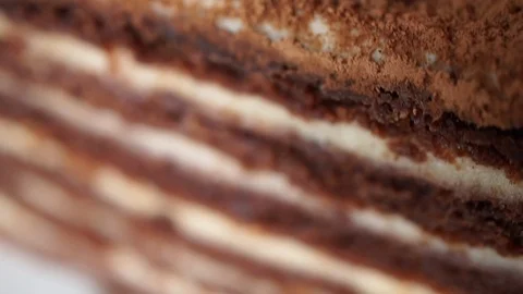 Slow motion closeup view of a texture of a chocolate cake with raspberries Stock Footage 117913079