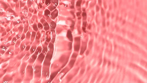 Slow motion closeup water surface texture splash and ripples on pink background Stock Footage 175641863