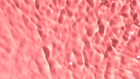 Slow motion closeup water surface texture splash and ripples on pink background 動画素材 199188395
