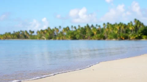 Slow motion closeup of waves on yellow sand of the tropical beach. Stock Footage 169208456