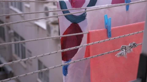 Slow motion clothesline inside building Stock Footage 339805953