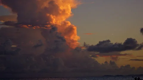 Slow Motion of Clouds Dyed by the Sunset Stock Footage 332514538
