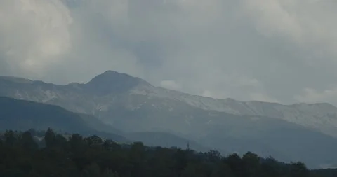 Slow motion cloudy sky above Parangul mare 4K video Video stock 252858777