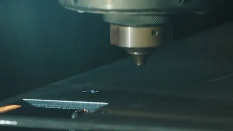 Slow motion of CNC Laser cutting a metal plate Stock Footage 79413334