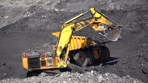 Slow motion of coal loading 24p Stock Footage 90490647