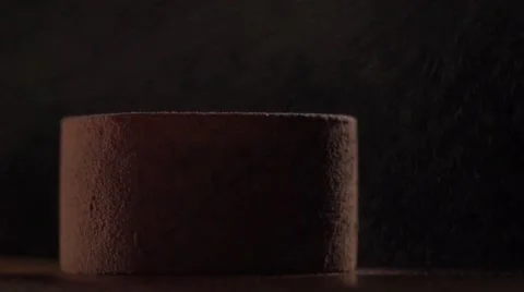 Slow motion cocoa powder spray on dessert Stock Footage 68962987