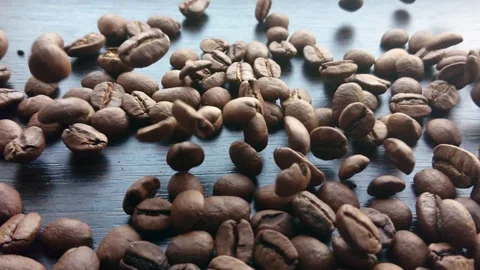 Slow motion coffee beans falling Stock Footage 88656621
