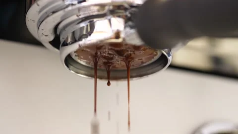 Slow Motion of coffee drop from espresso machine close up. Stock Footage 166871552