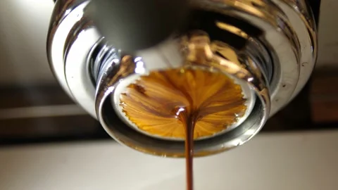 Slow Motion of coffee drop from espresso machine close up Video stock 166931940