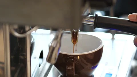 Slow Motion of coffee drop from espresso machine close up. Stock Footage 167244605