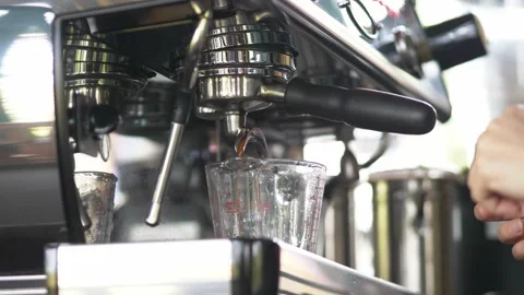 Slow Motion of coffee drop from espresso machine close up Stock Footage 167294842