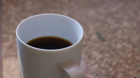 Slow motion coffee pour Stock Footage 93968372