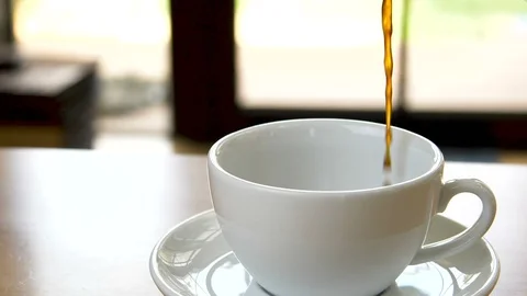 Slow motion coffee pour on white glass Stock Footage 101455511