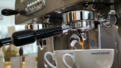 Slow motion coffee pouring in cup Stock Footage 90388779