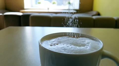 Slow motion coffee with sugar. Cappuccino. Stir with a spoon. Stock Footage 94583732