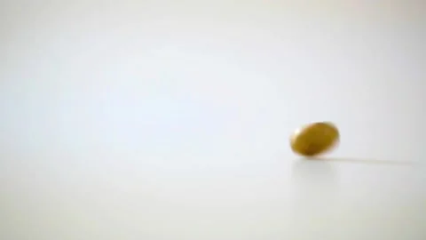 Slow Motion Coin Spin and Stop - Finance, Choice, Chance Stock Footage 320098792