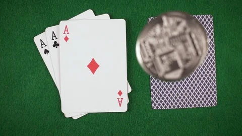 Slow motion coins fall on the cards on the table top view Stock Footage 85642338