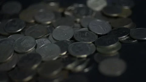 Slow motion coins falling. Stock Footage 148702312