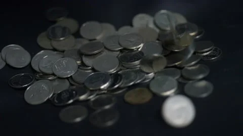 Slow motion coins falling. Stock Footage 148702334