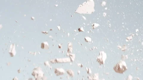 Slow motion collision of light beige powders on grey Stock Footage 337125778