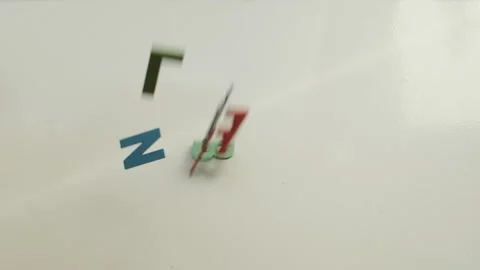 Slow motion of colored letters falling on a white background Stock Footage 130812054