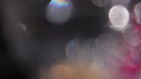 Slow motion of colored lights moving in the darkness. Stockbeeldmateriaal 318675640