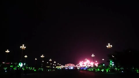 Slow Motion Colorful fireworks that explode and fill the darkness of the nig Stock Footage 204619246