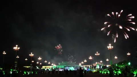 Slow Motion Colorful fireworks that explode and fill the darkness of the nig Stock Footage 204619257