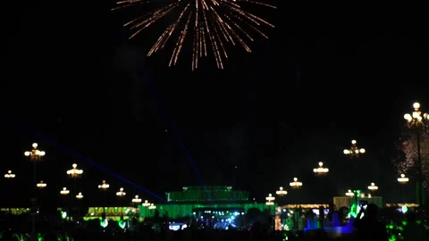 Slow Motion Colorful fireworks that explode and fill the darkness of the nig Stock Footage 204621418