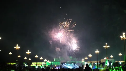 Slow Motion Colorful fireworks that explode and fill the darkness of the nig Stock Footage 204634215