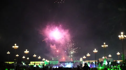 Slow Motion Colorful fireworks that explode and fill the darkness of the nig Stock Footage 204634237