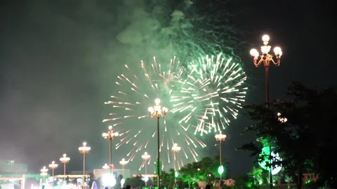 Slow Motion Colorful fireworks that explode and fill the darkness of the nig Stock Footage 204638042