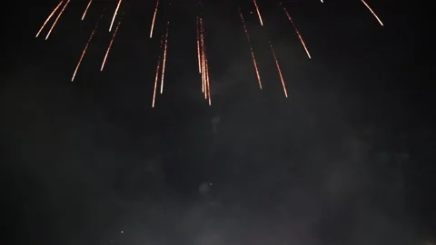 Slow Motion Colorful fireworks that explode and fill the darkness of the nig Stock Footage 204708185