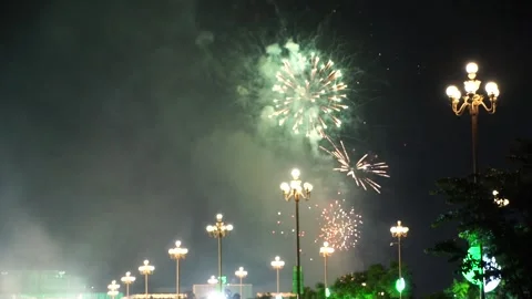 Slow Motion Colorful fireworks that explode and fill the darkness of the nig Stock Footage 204708189