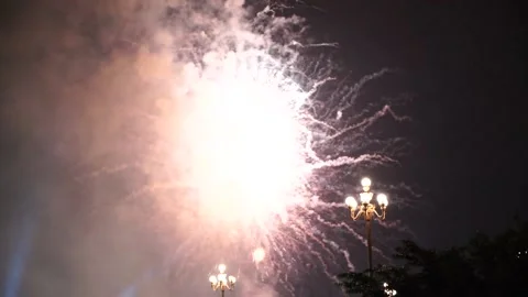 Slow Motion Colorful fireworks that explode and fill the darkness of the nig Stock Footage 204708589