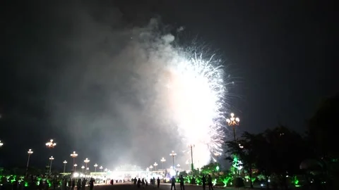 Slow Motion Colorful fireworks that explode and fill the darkness of the nig Stock Footage 204708650