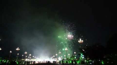 Slow Motion Colorful fireworks that explode and fill the darkness of the nig Stock Footage 204708708