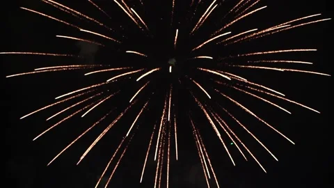 Slow Motion Colorful fireworks that explode and fill the darkness of the nig Stock Footage 204708889