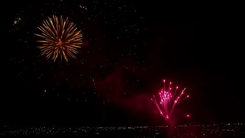 Slow motion, colorful fireworks exploding in the night sky Stock Footage 337057894