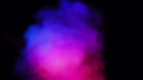 Slow-motion of a colorful rainbow of smoke covering the screen and then slowly m Stock Footage 257516169